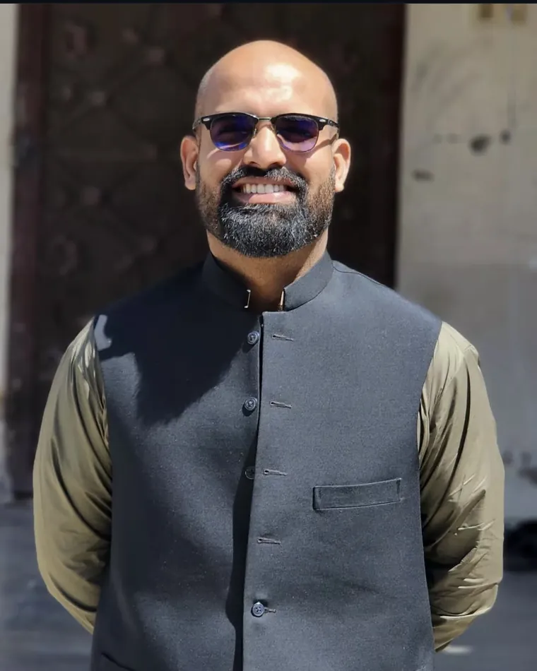 Zayteen's founder in an olive grove in Balochistan