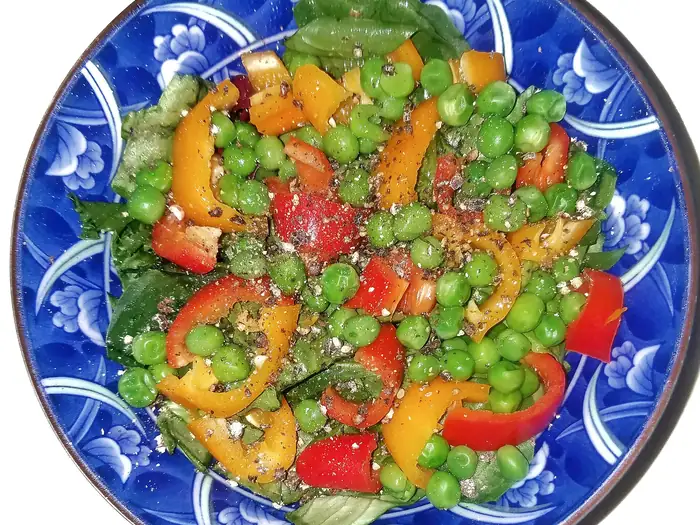 Fresh salad dressed with olive oil